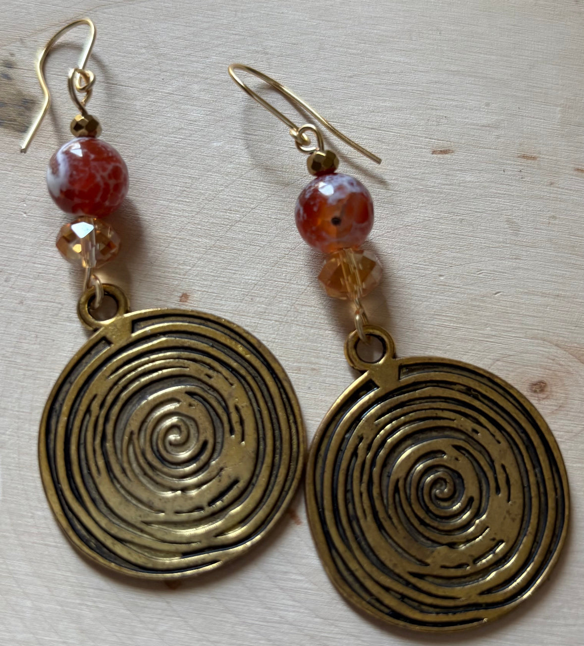 “Brass Boldness” orange fire agate/brass medallion dangle earring